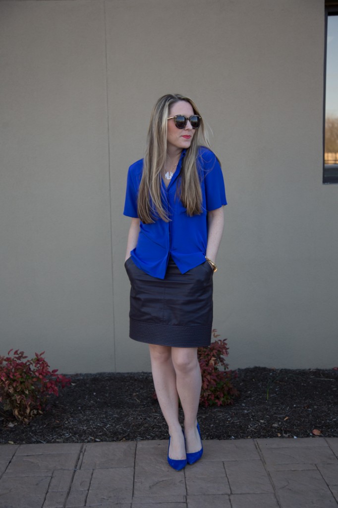 Cobalt blouse, leather skirt, cobalt pumps and monogram neckalce