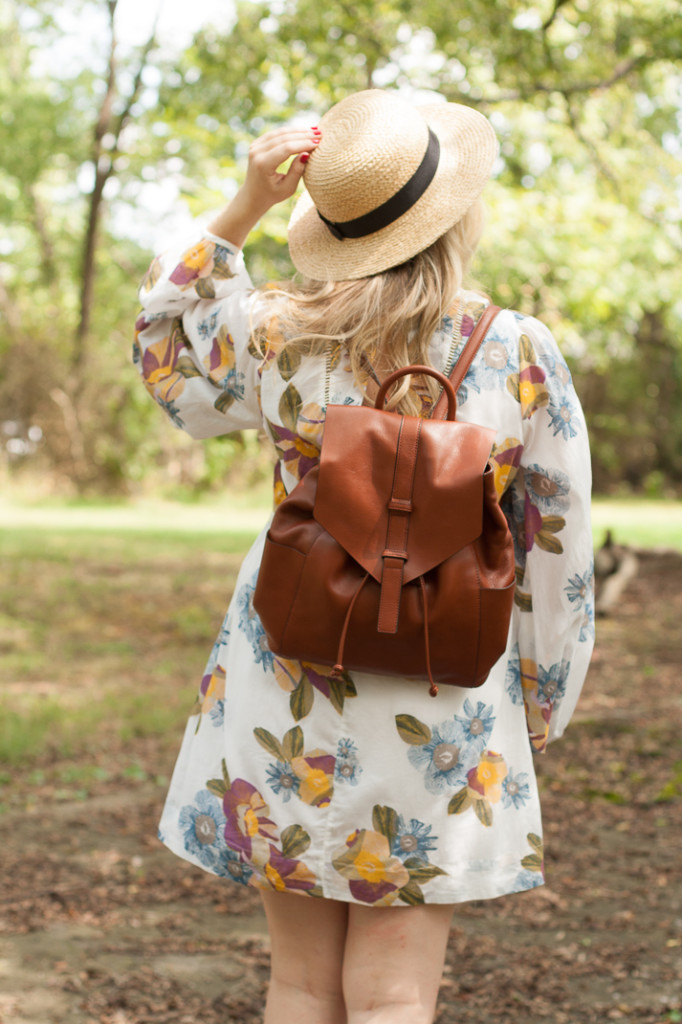 free people flirty floral dress and brown leather backpack
