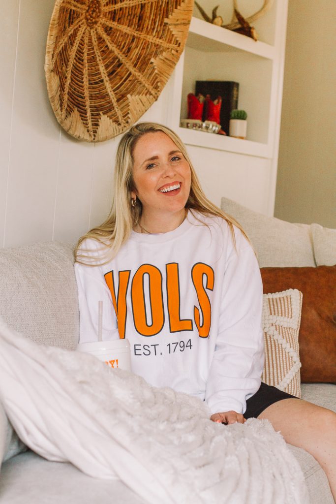 SEC Gameday by popular Nashville fashion blog, Pearls and Twirls: image of a woman wearing a My Kind of Lovely VOLS sweatshirt.  