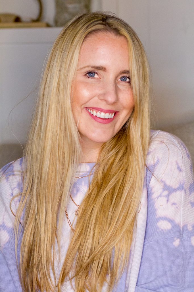 Heatless Waves by popular Nashville beauty blog, Pearl and Twirls: image of a woman with long straight blonde hair and wearing a purple tie dye shirt. 