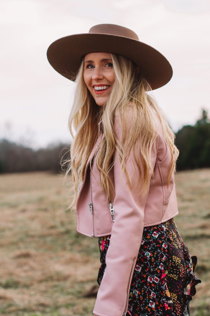 how to get unstuck |How to Get Unstuck by popular Nashville lifestyle blog, Pearls and Twirls: image of a woman standing in a field and wearing a Charlie 1 Horse felt boater hat, Nuuly pink leather jacket, and Nuuly maxi ruffle floral print skirt. 